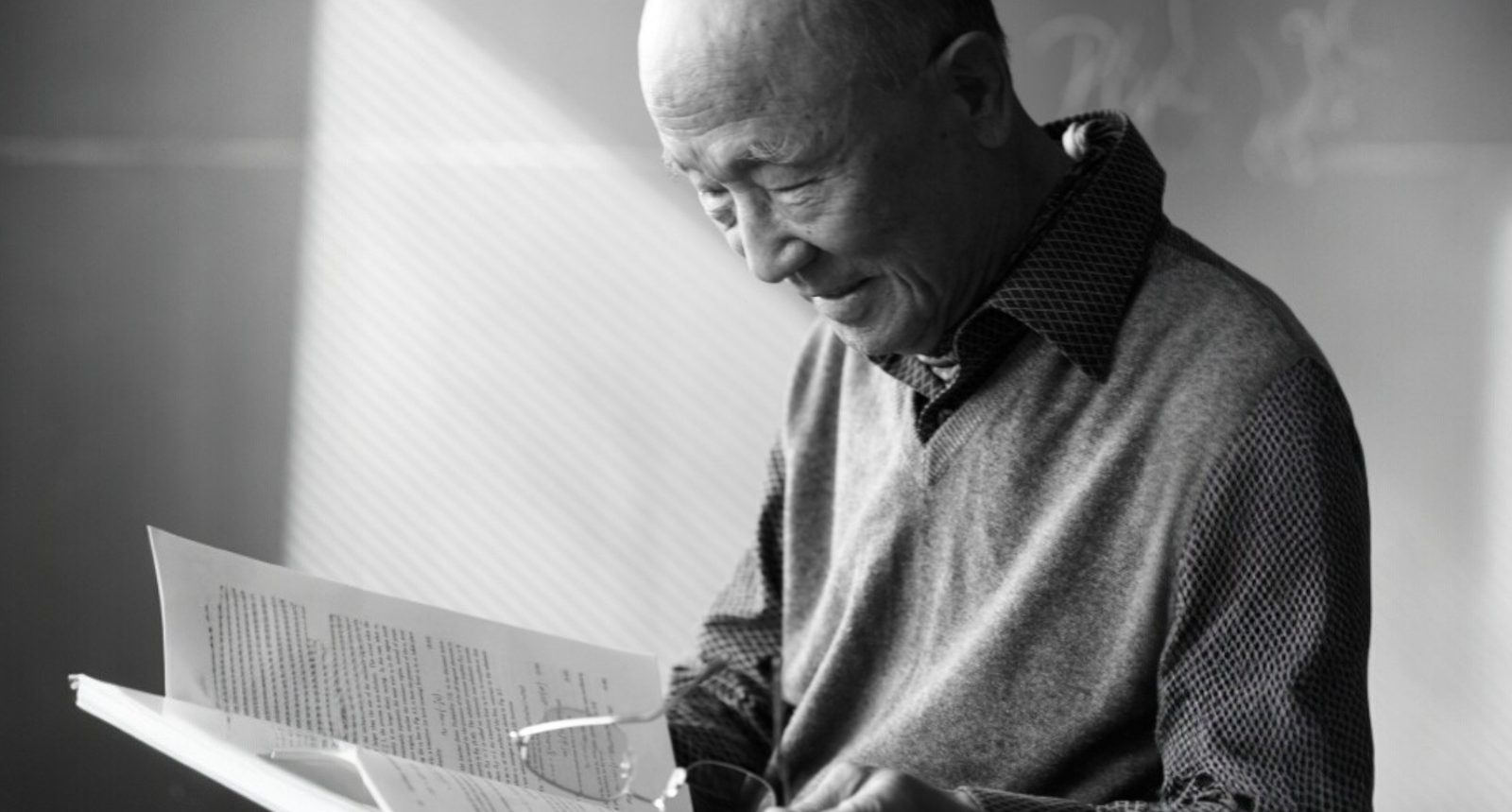 The late Professor Chung-Wook Kim reading a manuscript